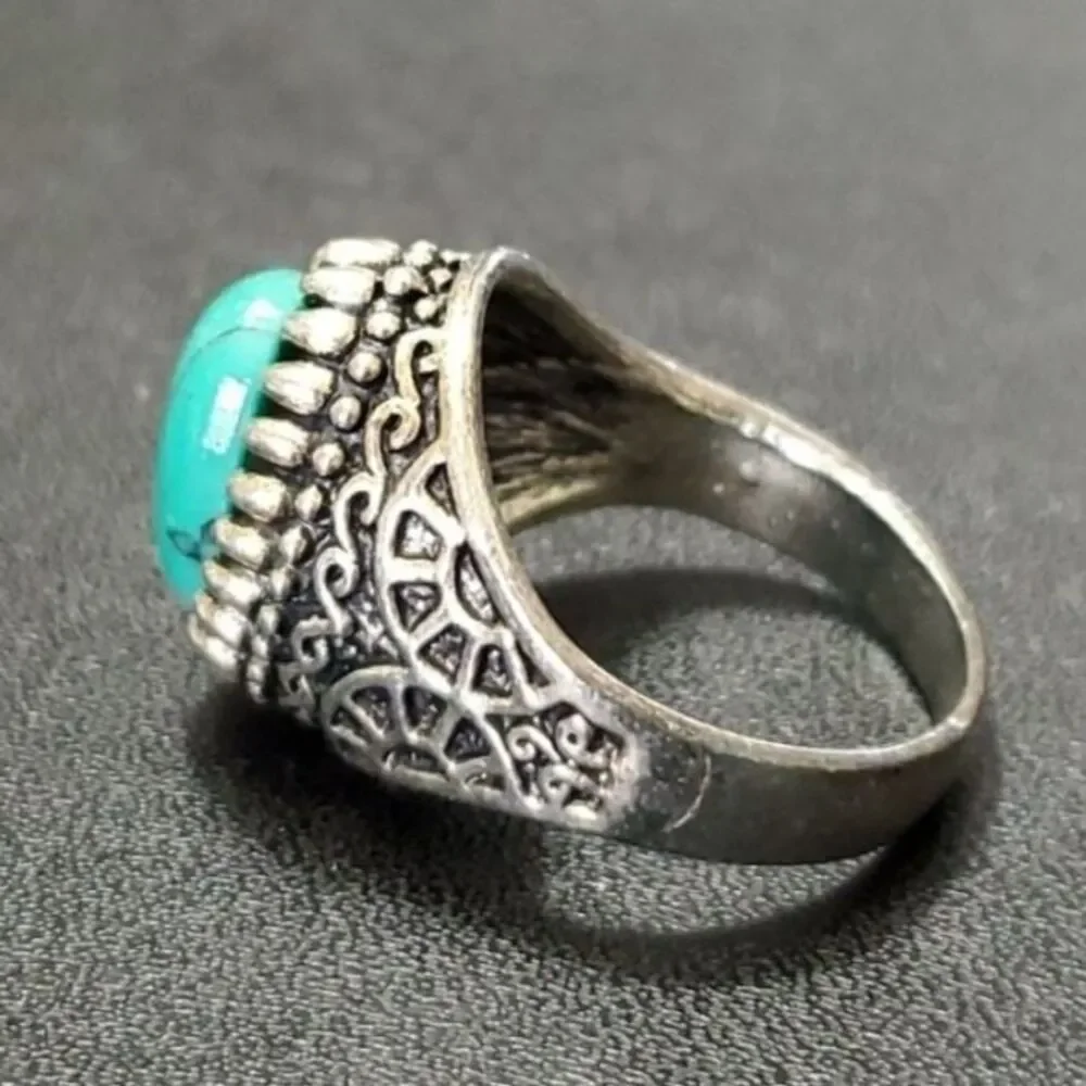 Silver tone ring with blue stone approx 11